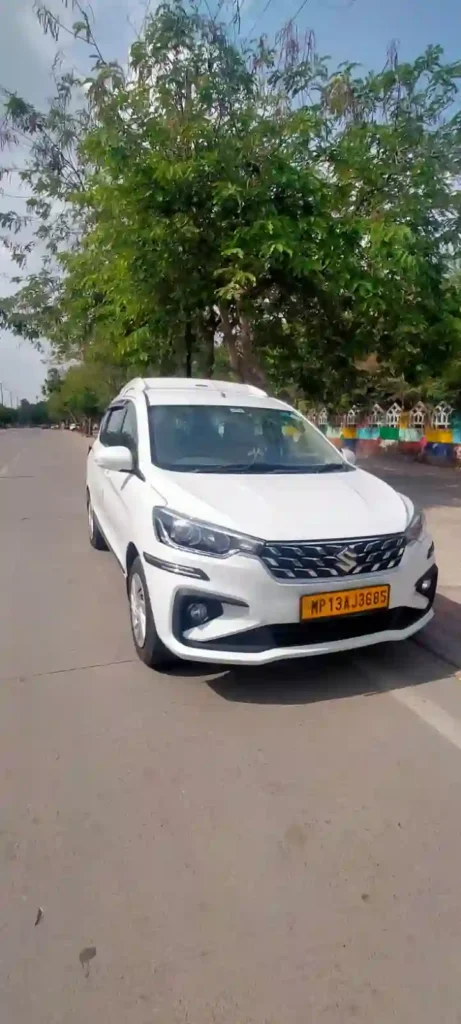 Indore Taxi Gallery featuring a clean white Ertiga taxi