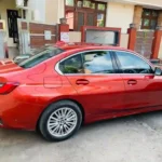 Car Rental in Indore with premium red sedan for comfortable travel